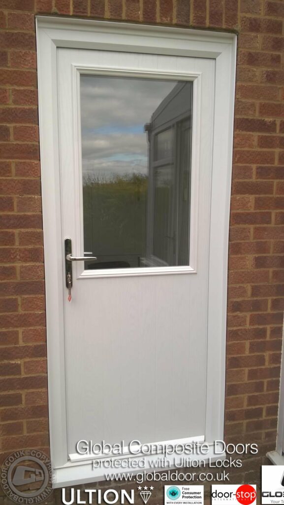 The perfect balance of light and privacy: The Door-Stop Cottage Half Glaze (V) composite door features an authentic vertical-groove lower skin and a expansive upper window