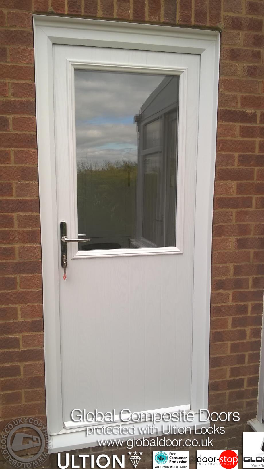 The perfect balance of light and privacy: The Door-Stop Cottage Half Glaze (V) composite door features an authentic vertical-groove lower skin and a expansive upper window